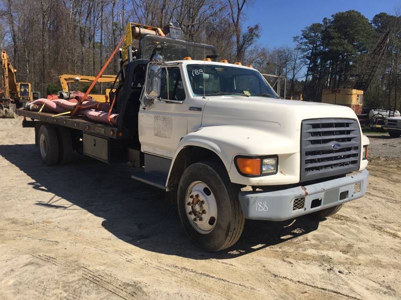 solid 1997 Ford F Series Rollback truck