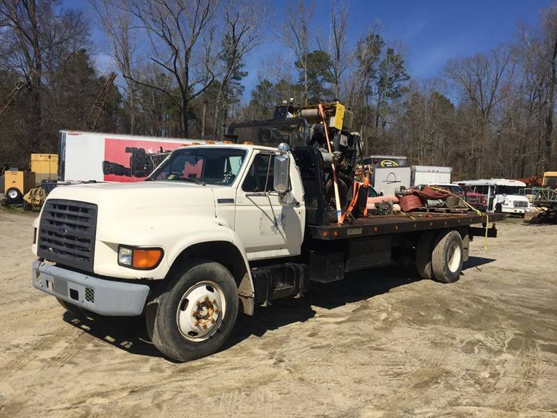 solid 1997 Ford F Series Rollback truck